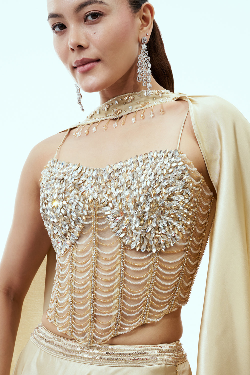Beige Satin Lehenga Set with Hand Embellished Corset Blouse