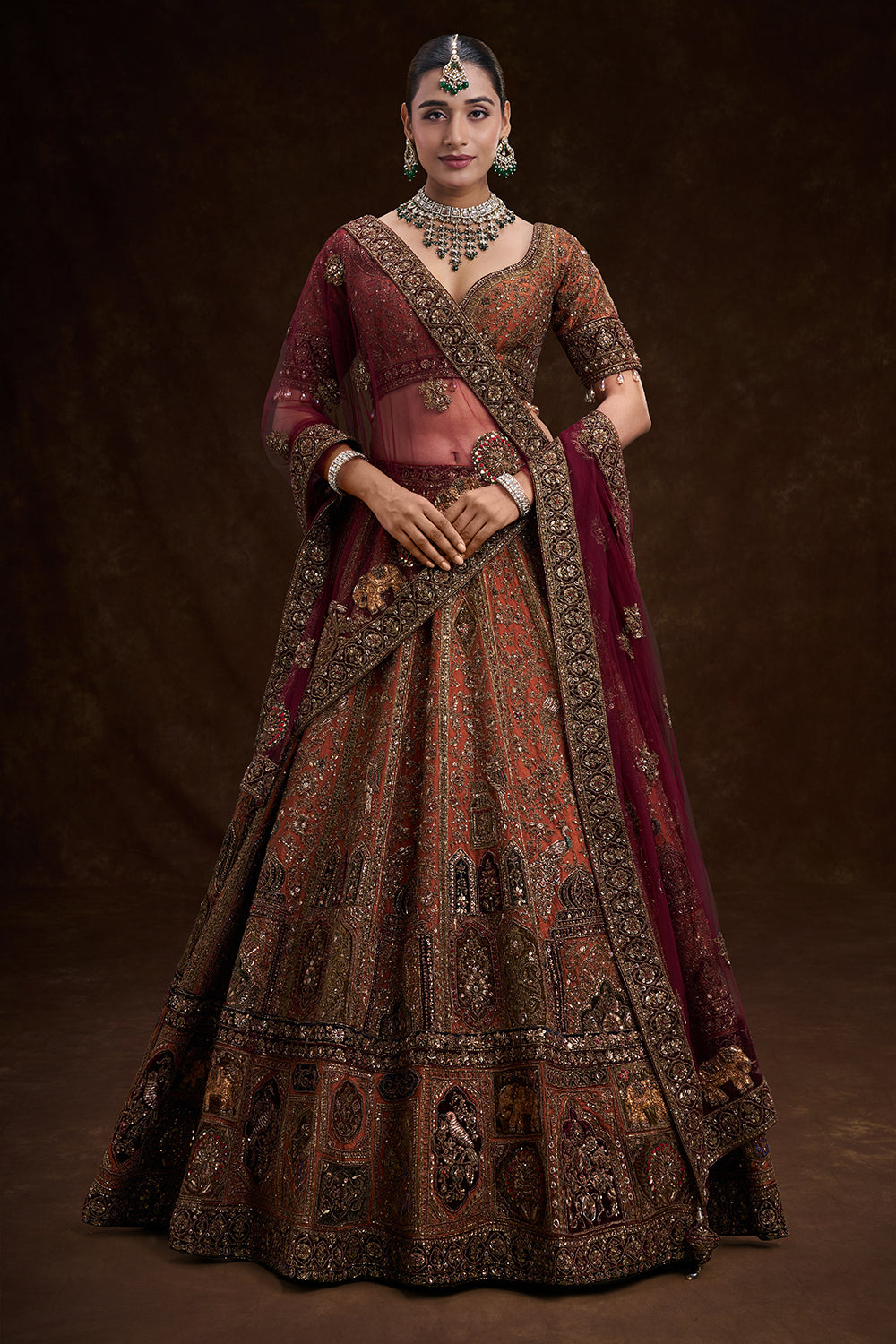 Copper Rust Raw Silk Bridal Lehenga with Palatial Motifs and Zardozi Work
