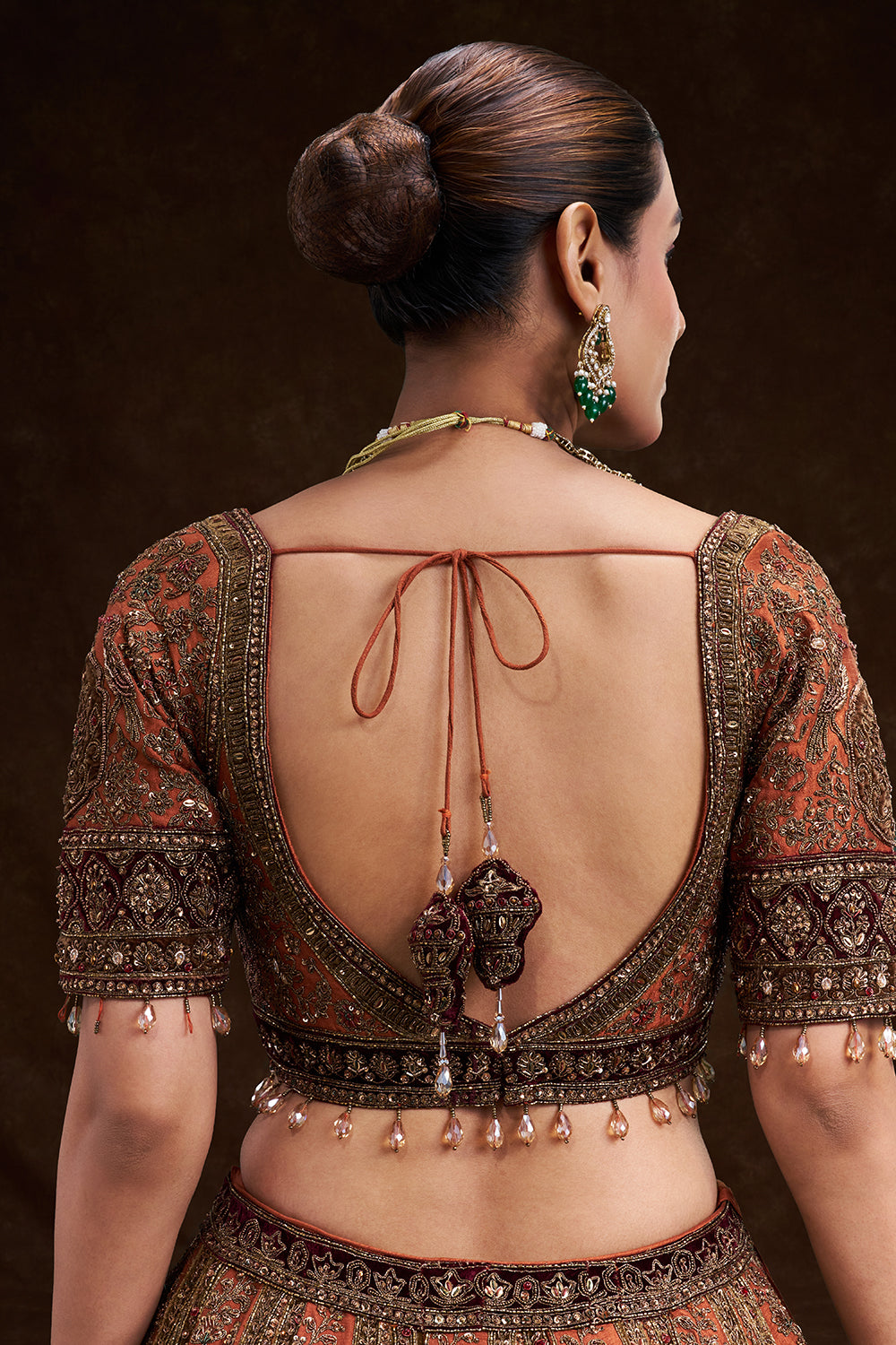 Copper Rust Raw Silk Bridal Lehenga with Palatial Motifs and Zardozi Work