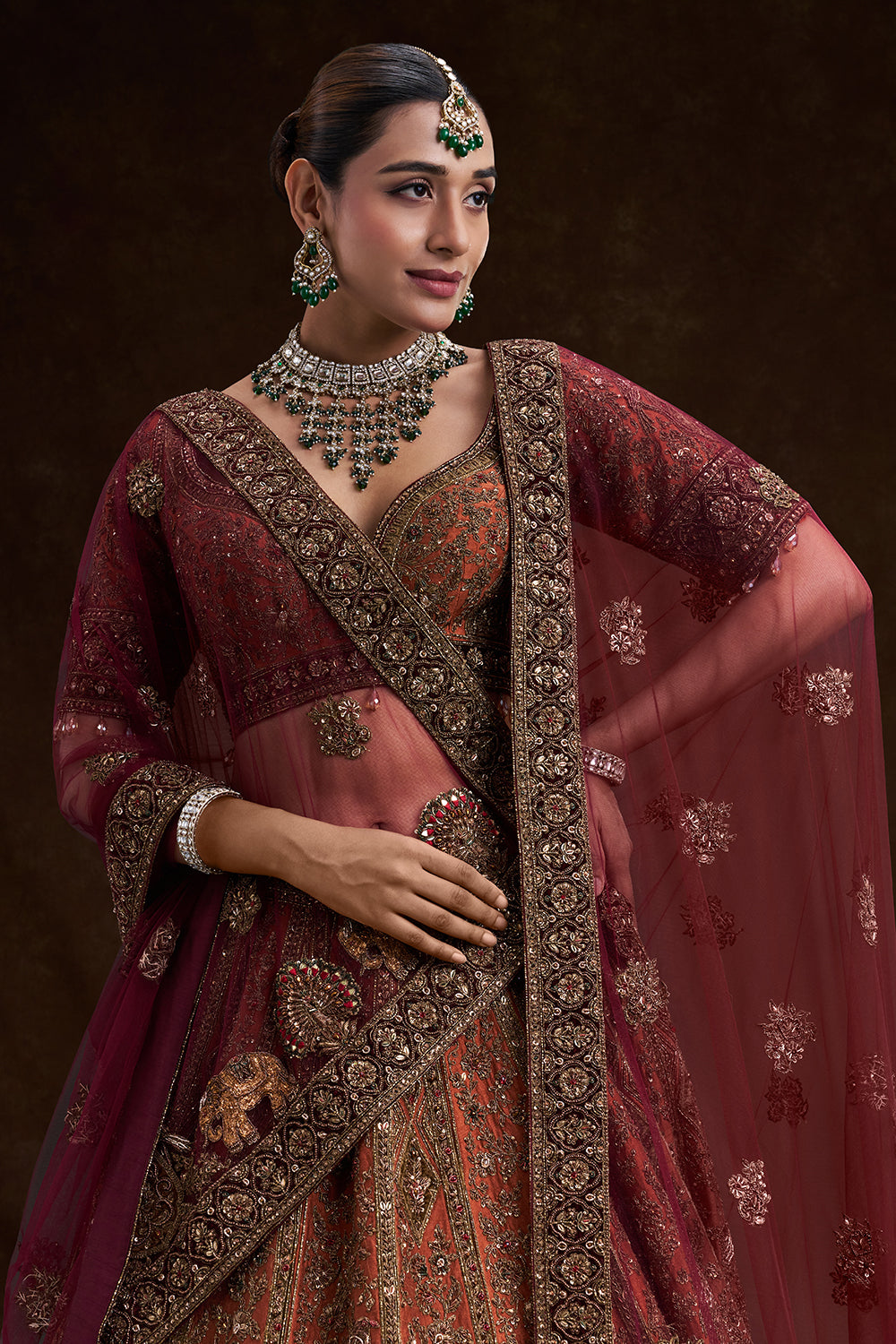 Copper Rust Raw Silk Bridal Lehenga with Palatial Motifs and Zardozi Work