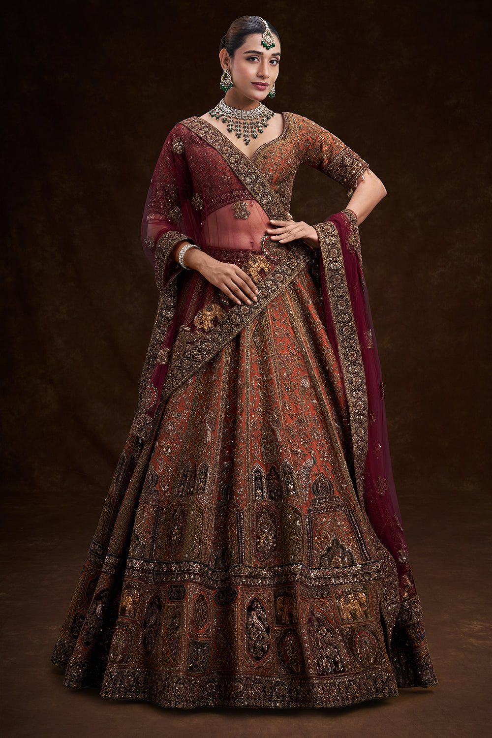 Copper Rust Raw Silk Bridal Lehenga with Palatial Motifs and Zardozi Work
