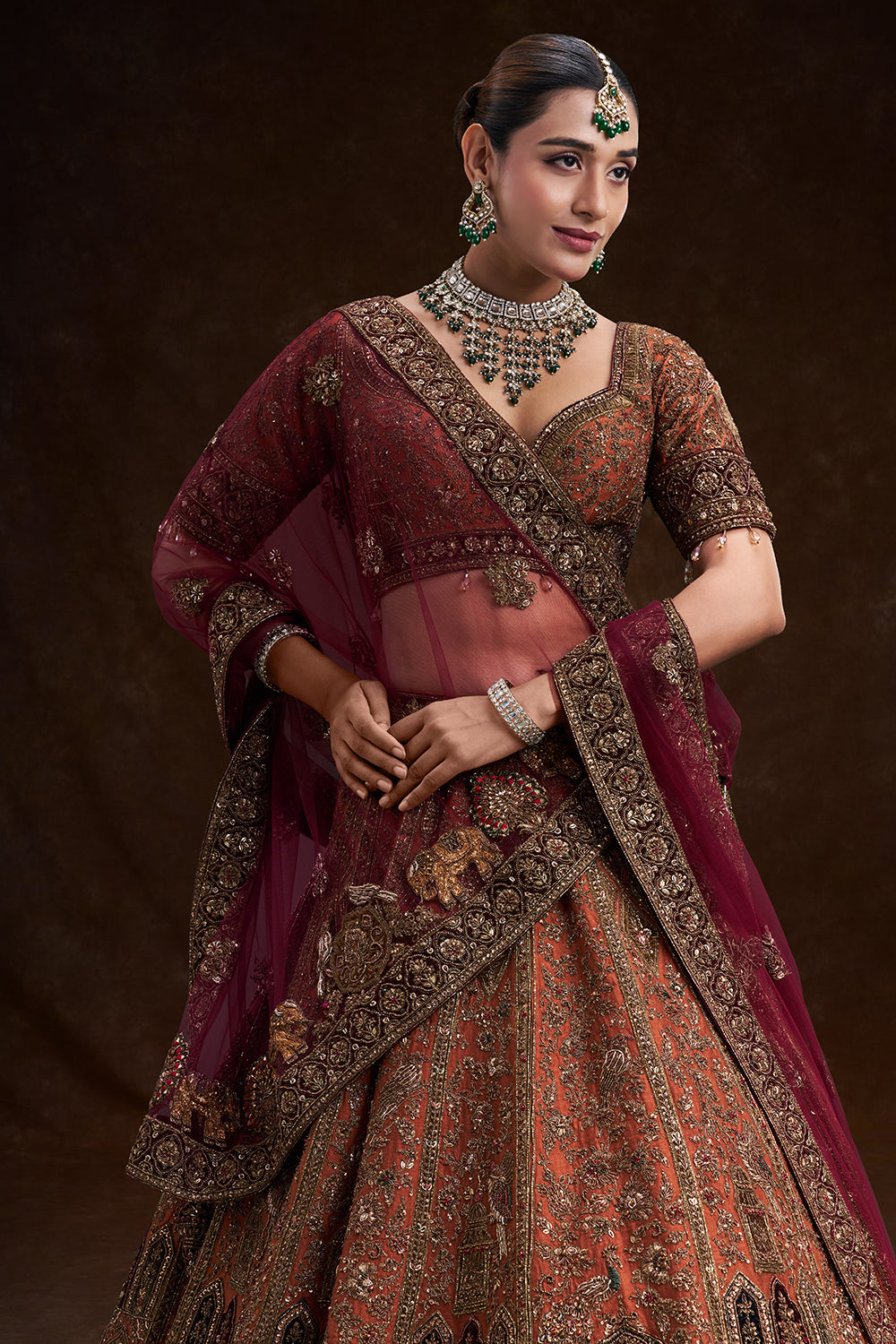 Copper Rust Raw Silk Bridal Lehenga with Palatial Motifs and Zardozi Work