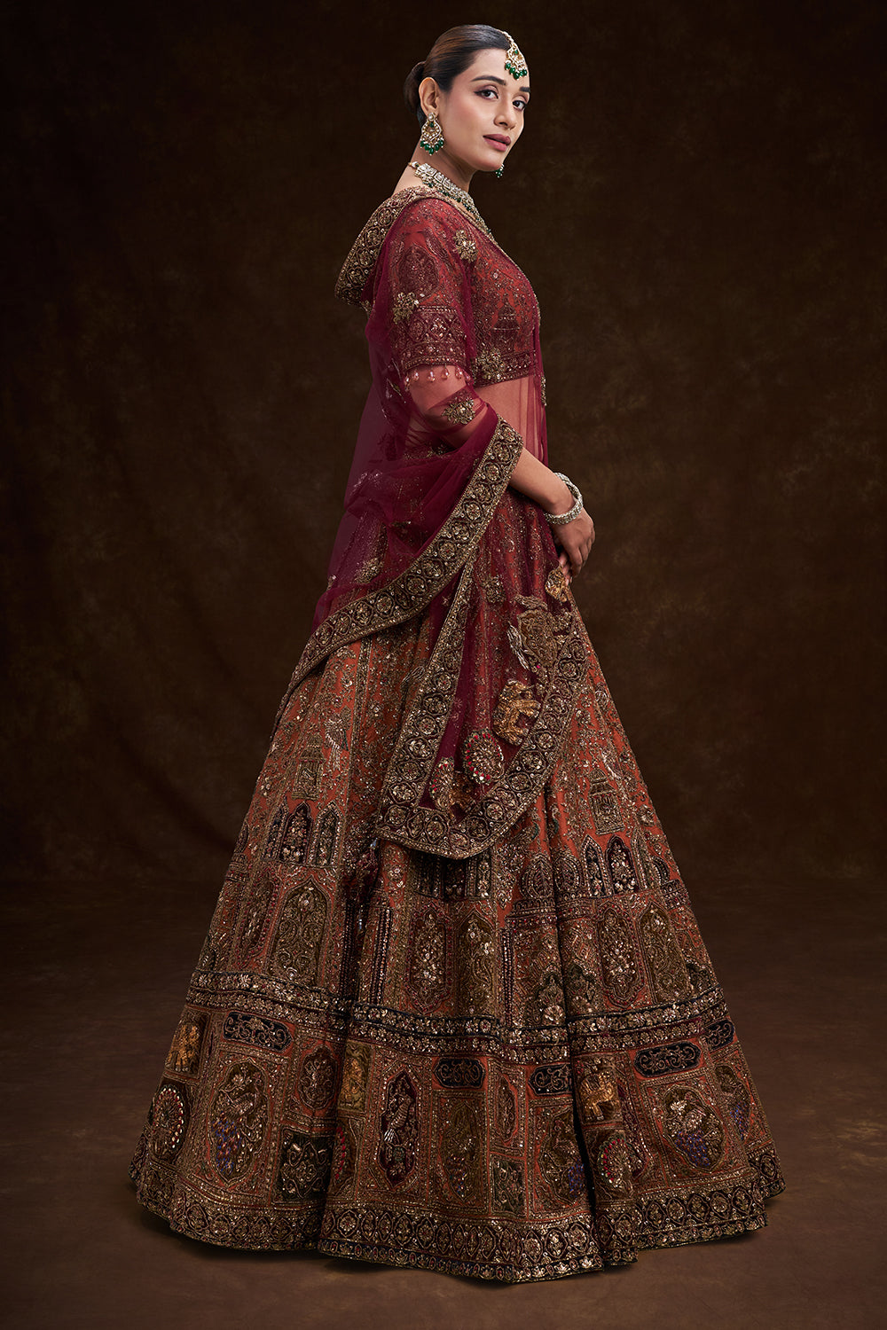 Copper Rust Raw Silk Bridal Lehenga with Palatial Motifs and Zardozi Work