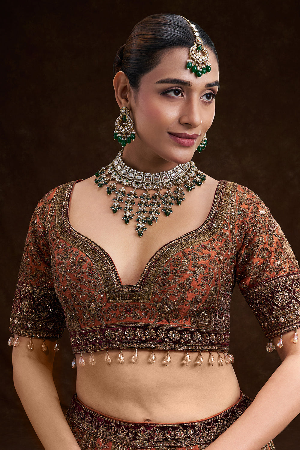 Copper Rust Raw Silk Bridal Lehenga with Palatial Motifs and Zardozi Work