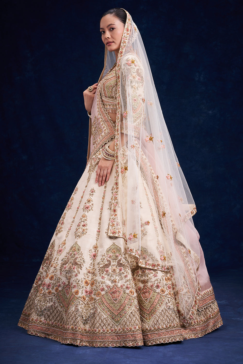Ivory Raw Silk Bridal Lehenga with Cutdana and Zari Work