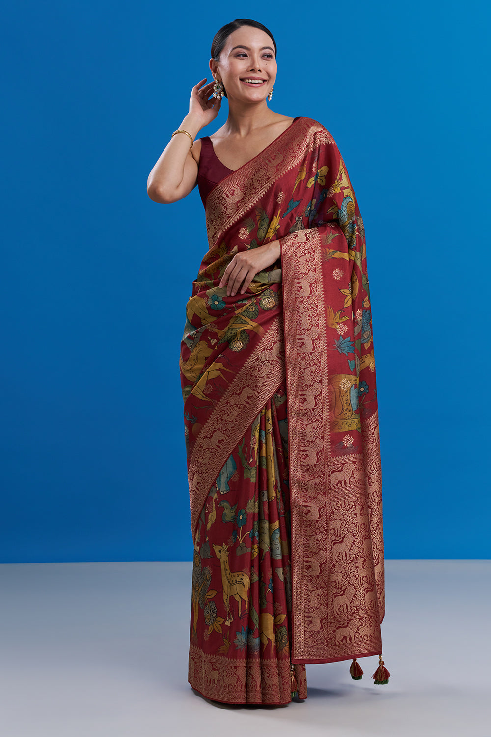 Maroon Silk Saree with Animal-Inspired Motifs Border And Unstitched Blouse