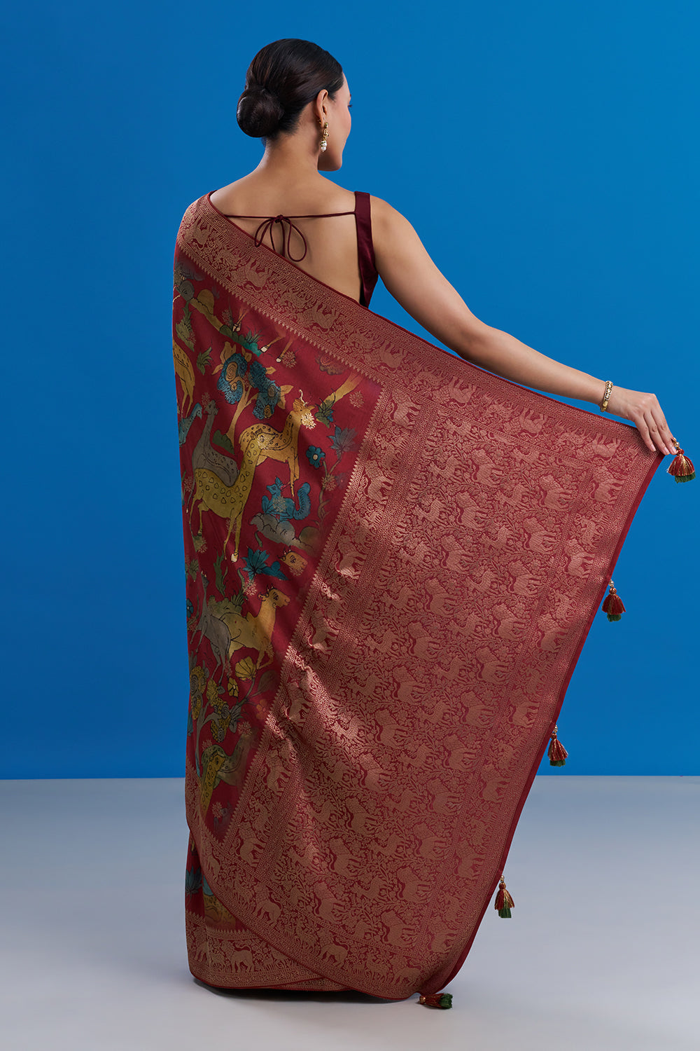 Maroon Silk Saree with Animal-Inspired Motifs Border And Unstitched Blouse