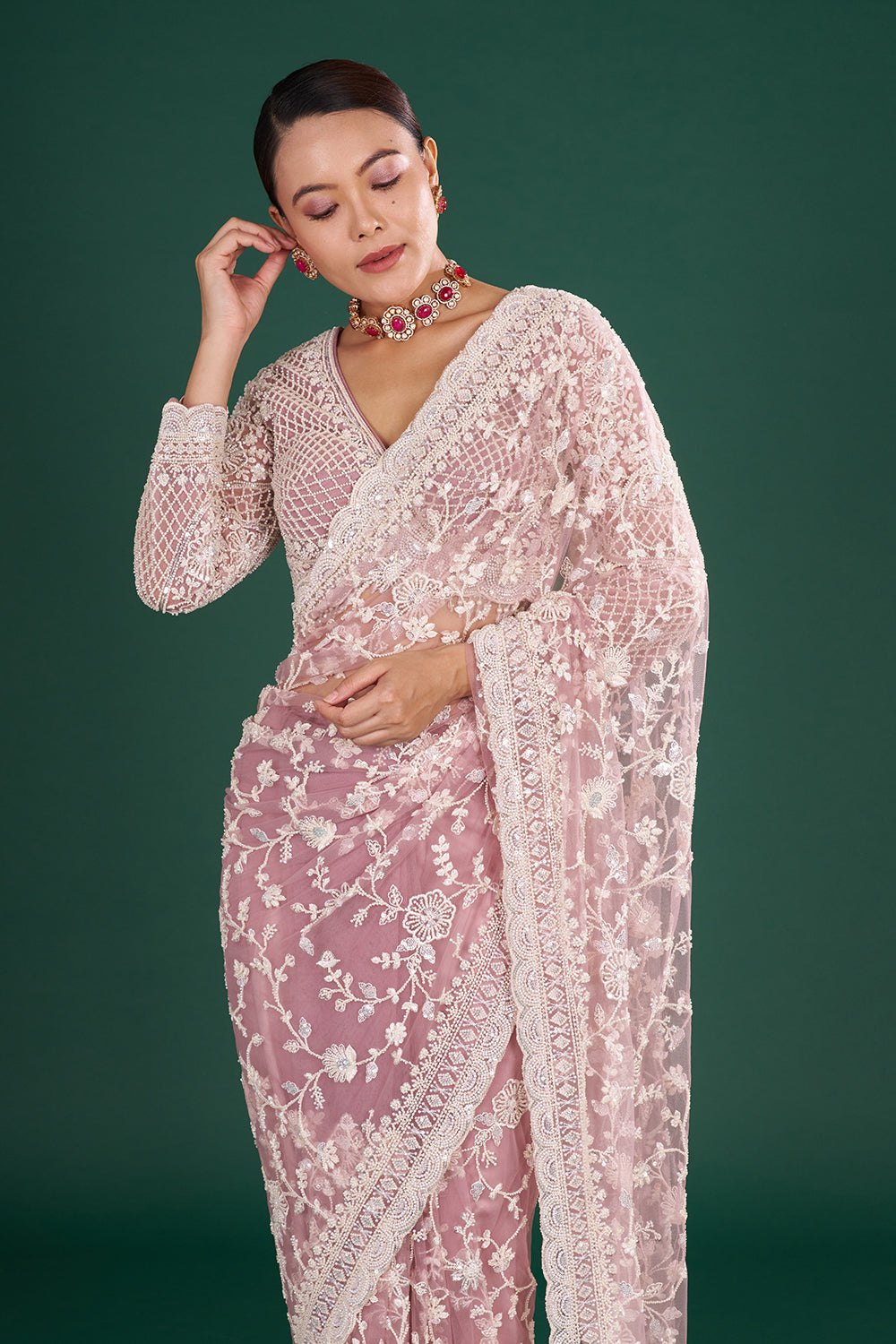 Mauve Embroidered Net Saree with Floral Embellishments and Stitched Blouse