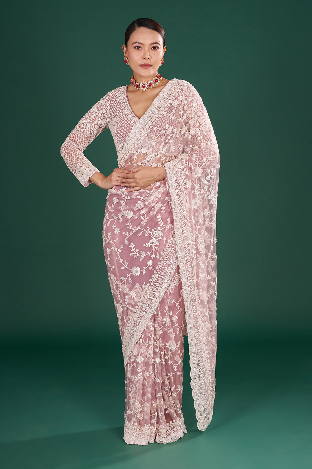 Mauve Embroidered Net Saree with Floral Embellishments and Stitched Blouse