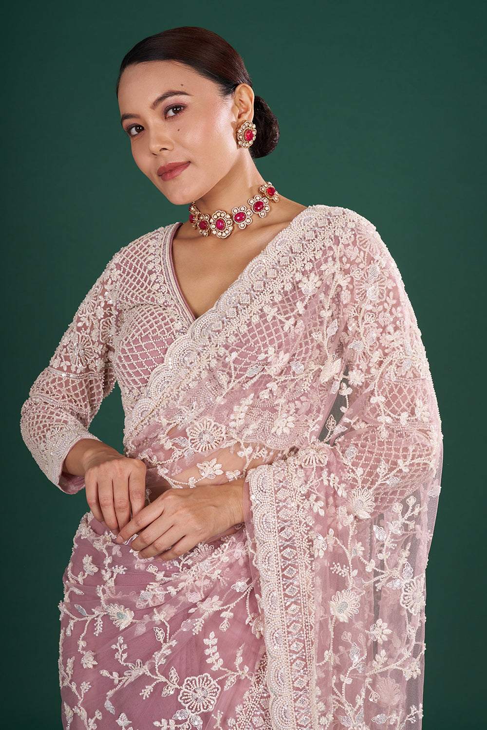Mauve Embroidered Net Saree with Floral Embellishments and Stitched Blouse