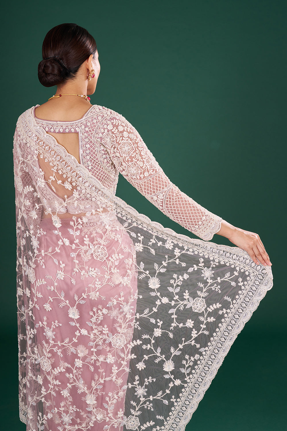 Mauve Embroidered Net Saree with Floral Embellishments and Stitched Blouse