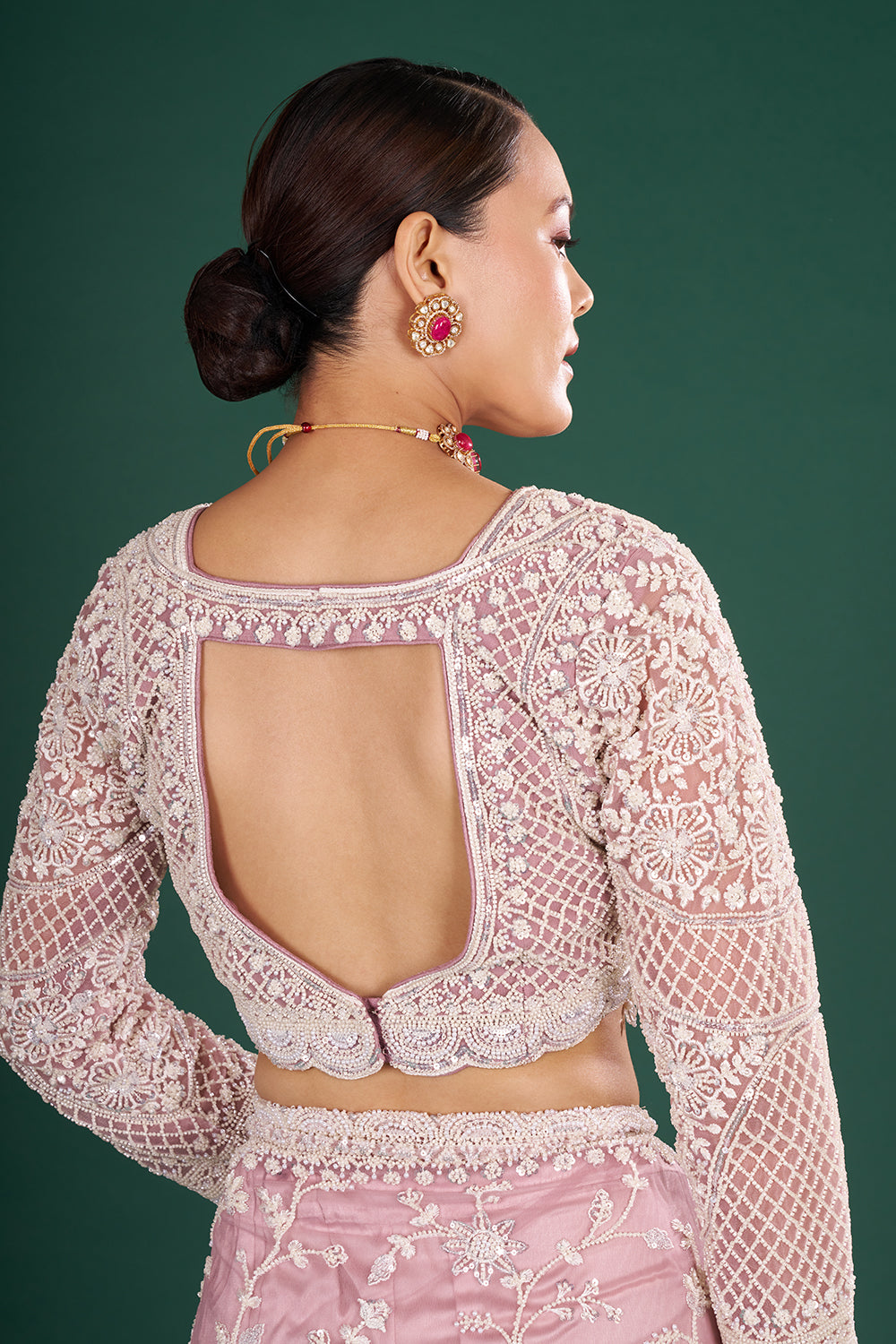 Mauve Embroidered Net Saree with Floral Embellishments and Stitched Blouse