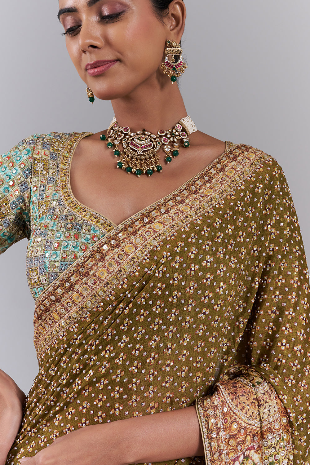 Mehendi Green Crepe Embellished Saree And Stitched Blouse