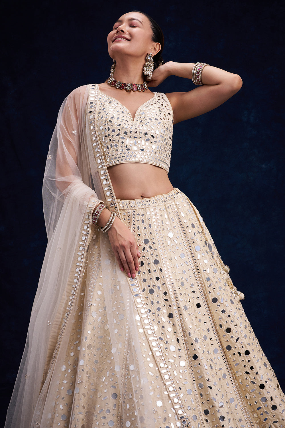 Off-White Raw Silk Bridal Lehenga with Mirror and Resham Work