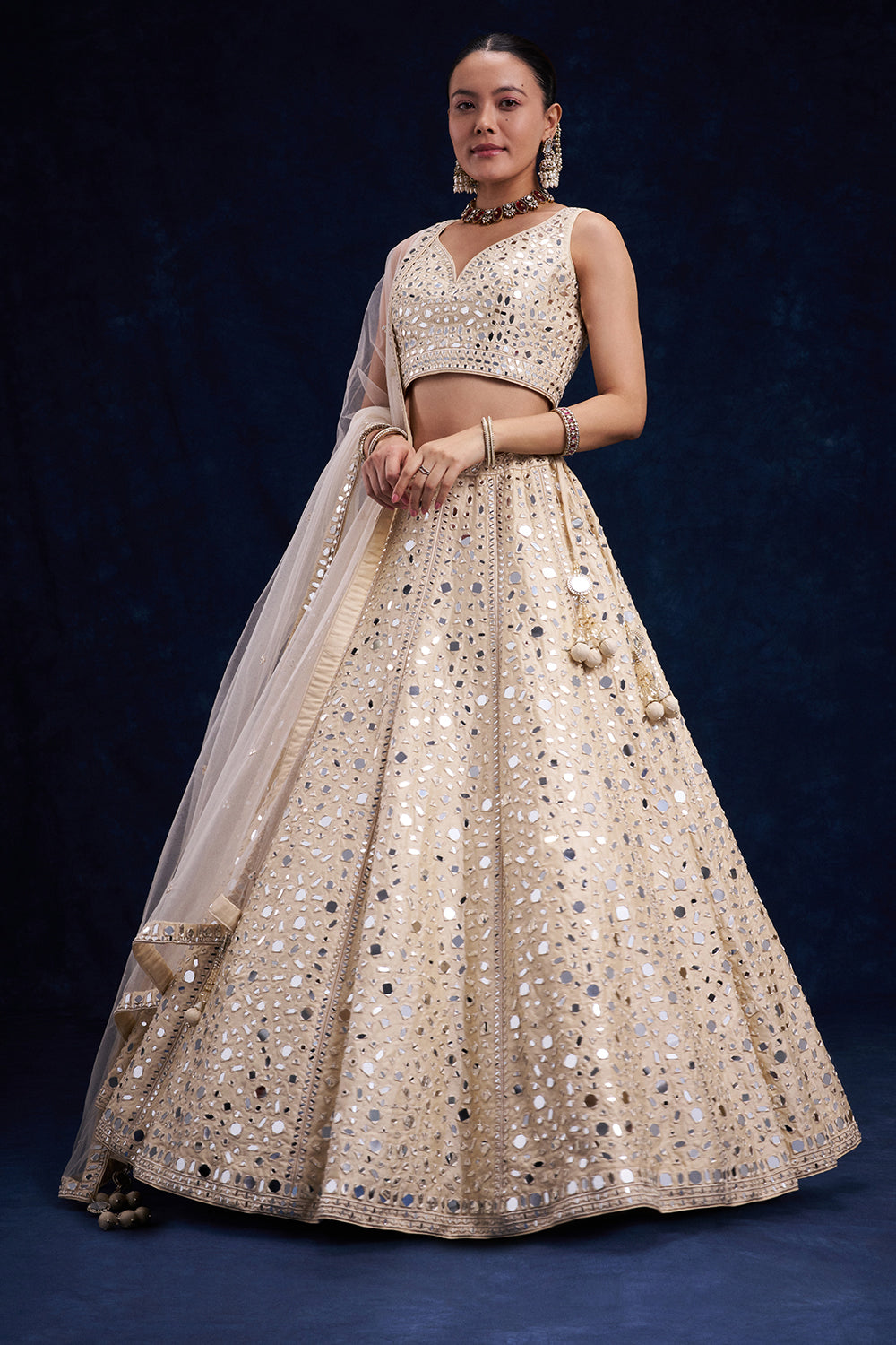 Off-White Raw Silk Bridal Lehenga with Mirror and Resham Work