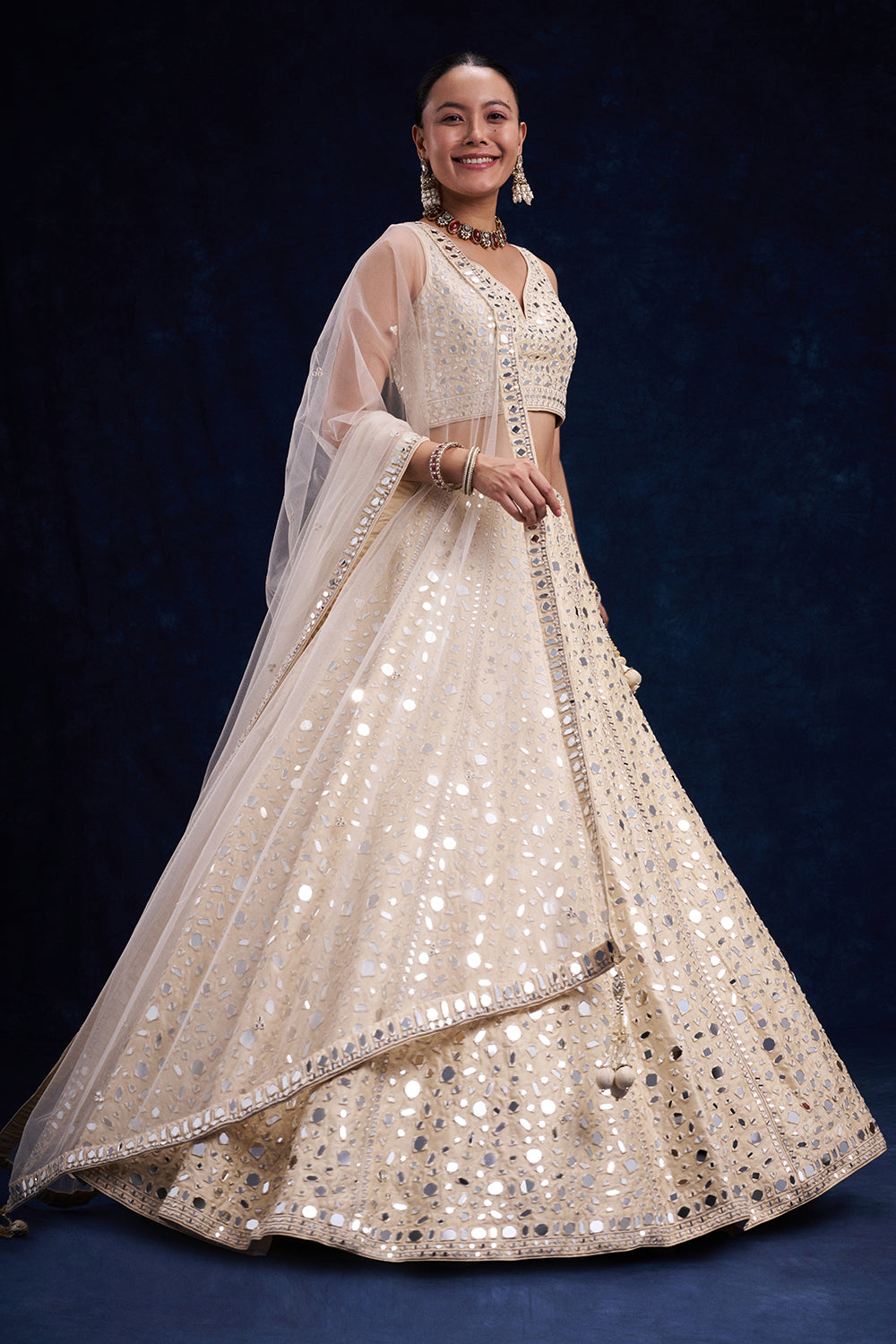 Off-White Raw Silk Bridal Lehenga with Mirror and Resham Work