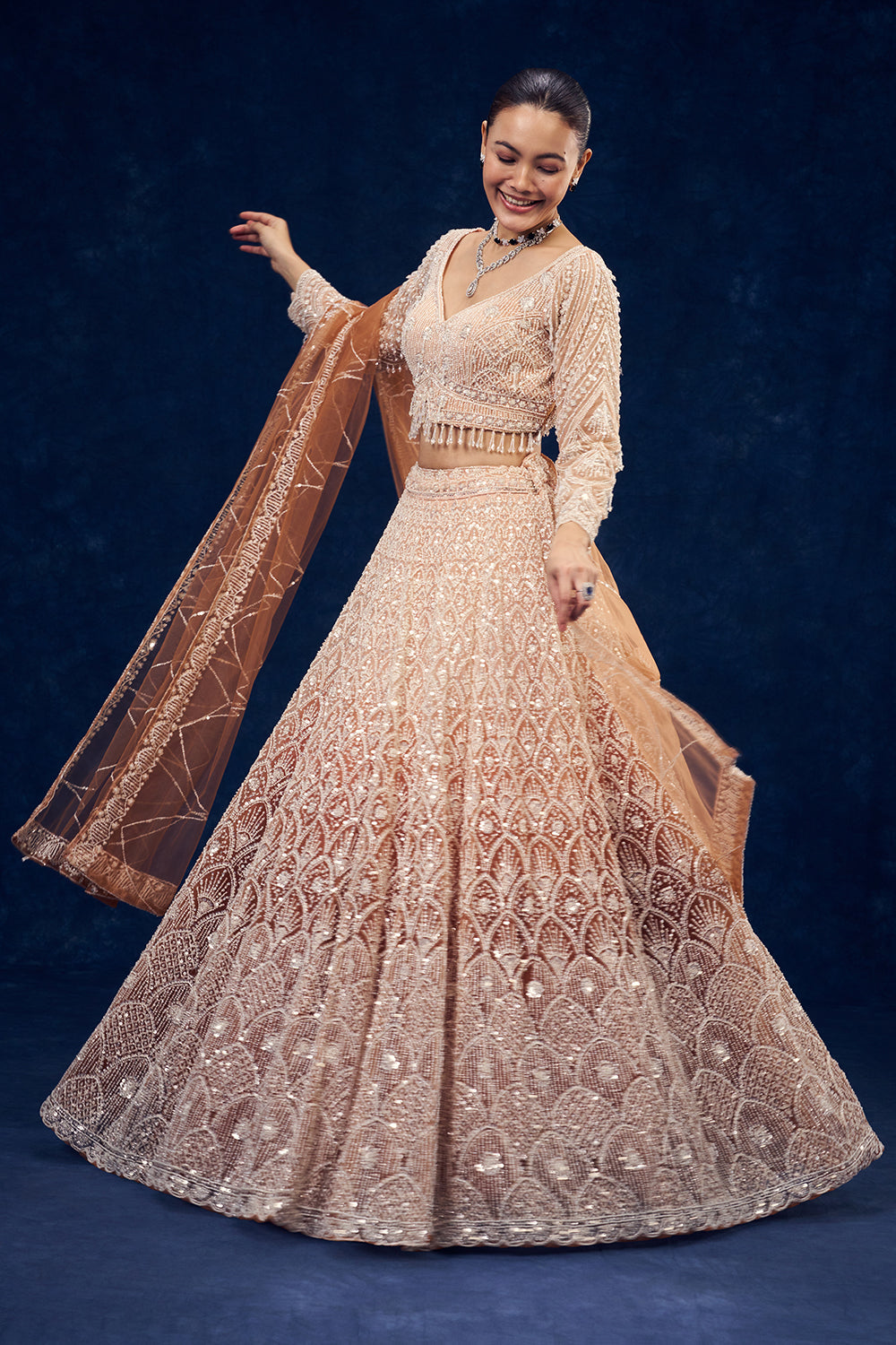 Peach and Orange Net Lehenga with Cutdana Hand Work