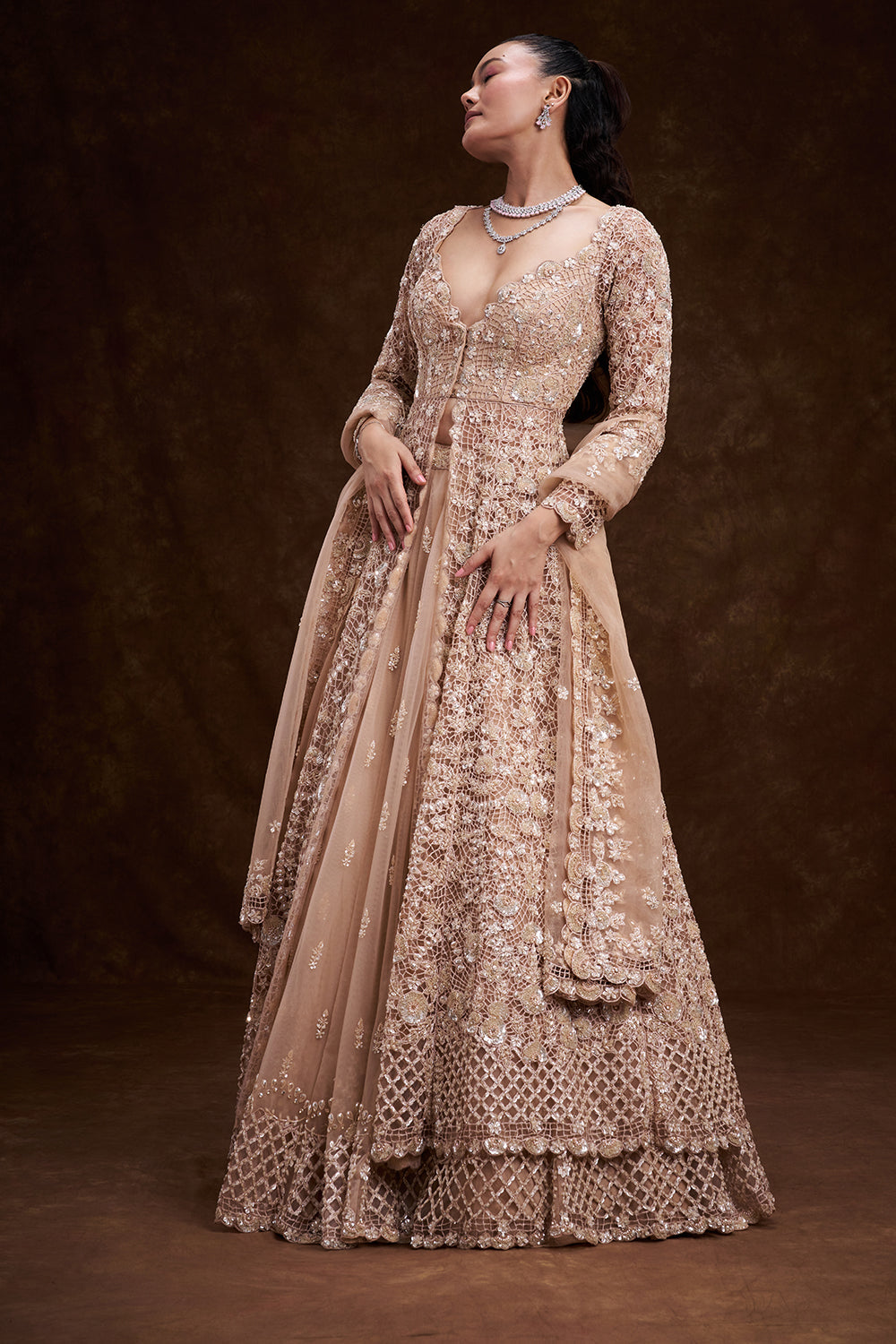 Peach Net Bridal Jacket Lehenga with Cutdana and Bead Embellishments