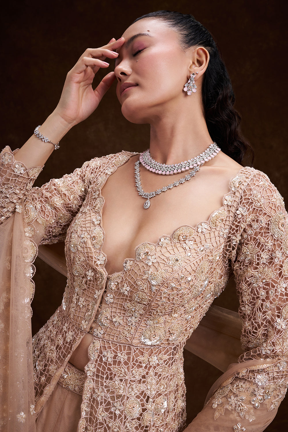 Peach Net Bridal Jacket Lehenga with Cutdana and Bead Embellishments
