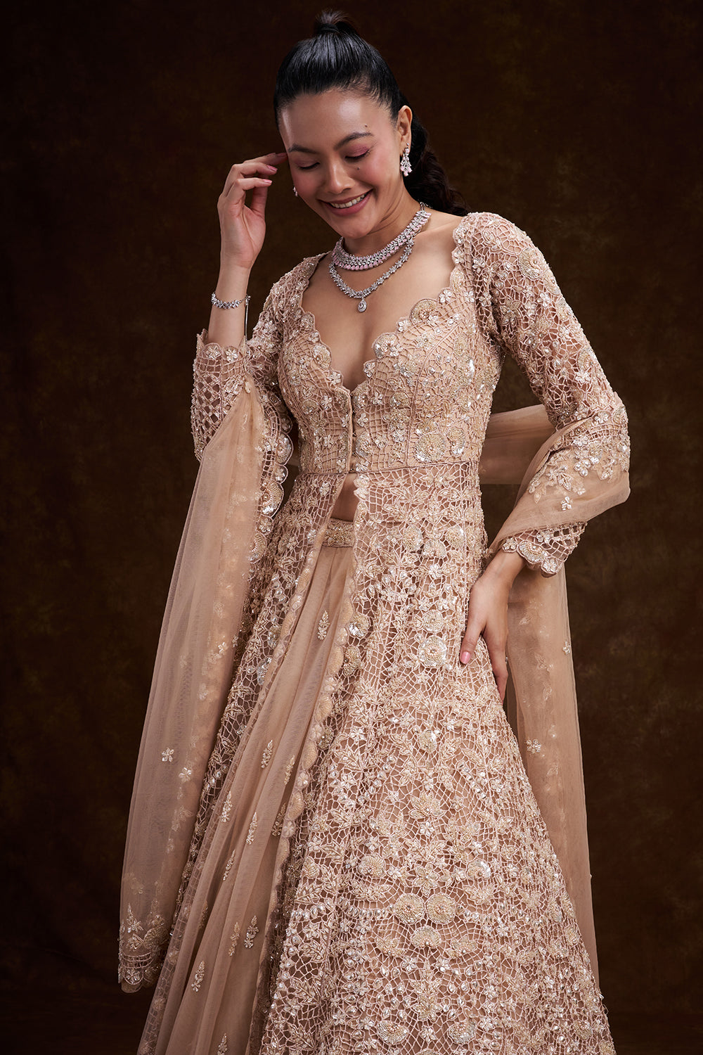 Peach Net Bridal Jacket Lehenga with Cutdana and Bead Embellishments