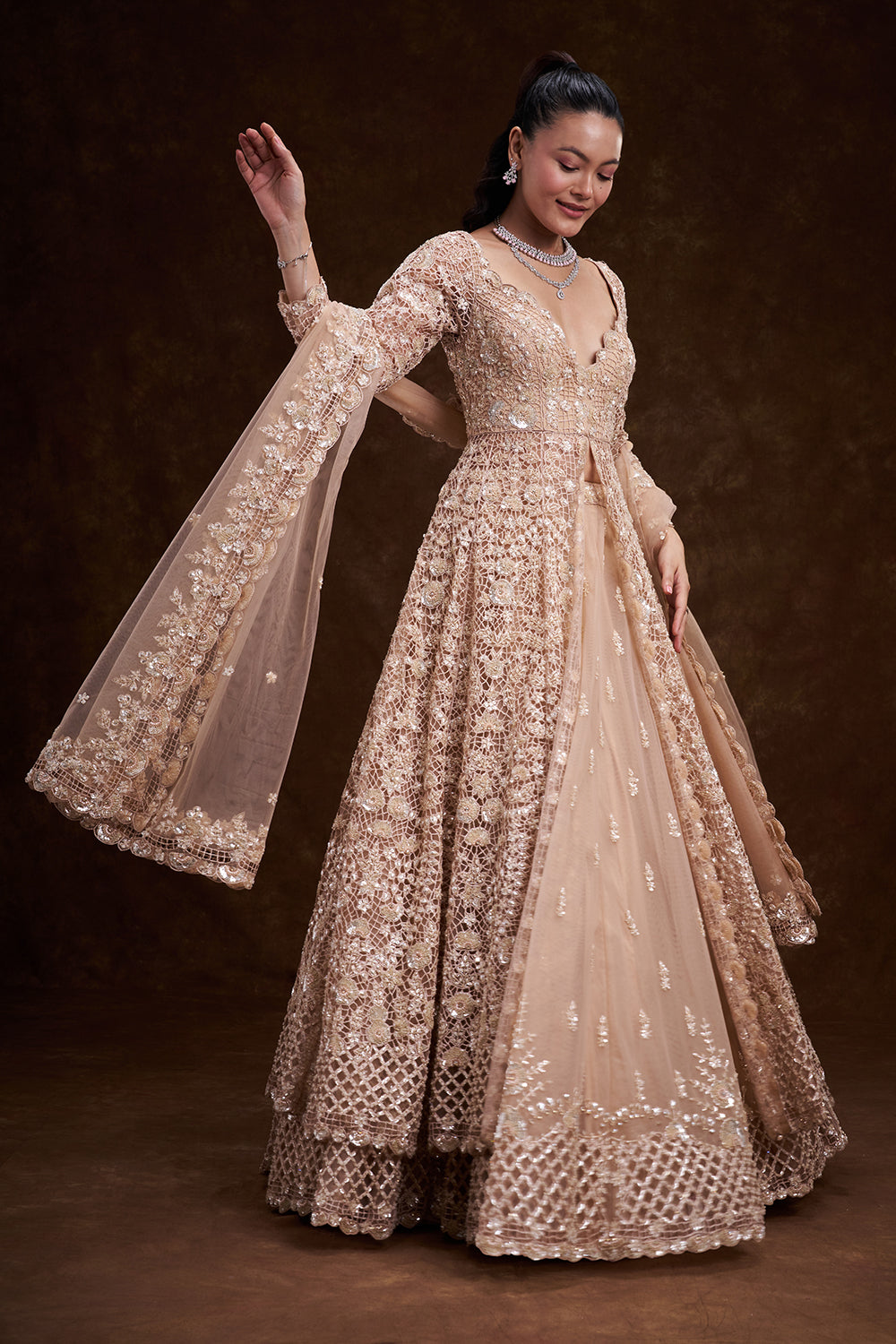 Peach Net Bridal Jacket Lehenga with Cutdana and Bead Embellishments