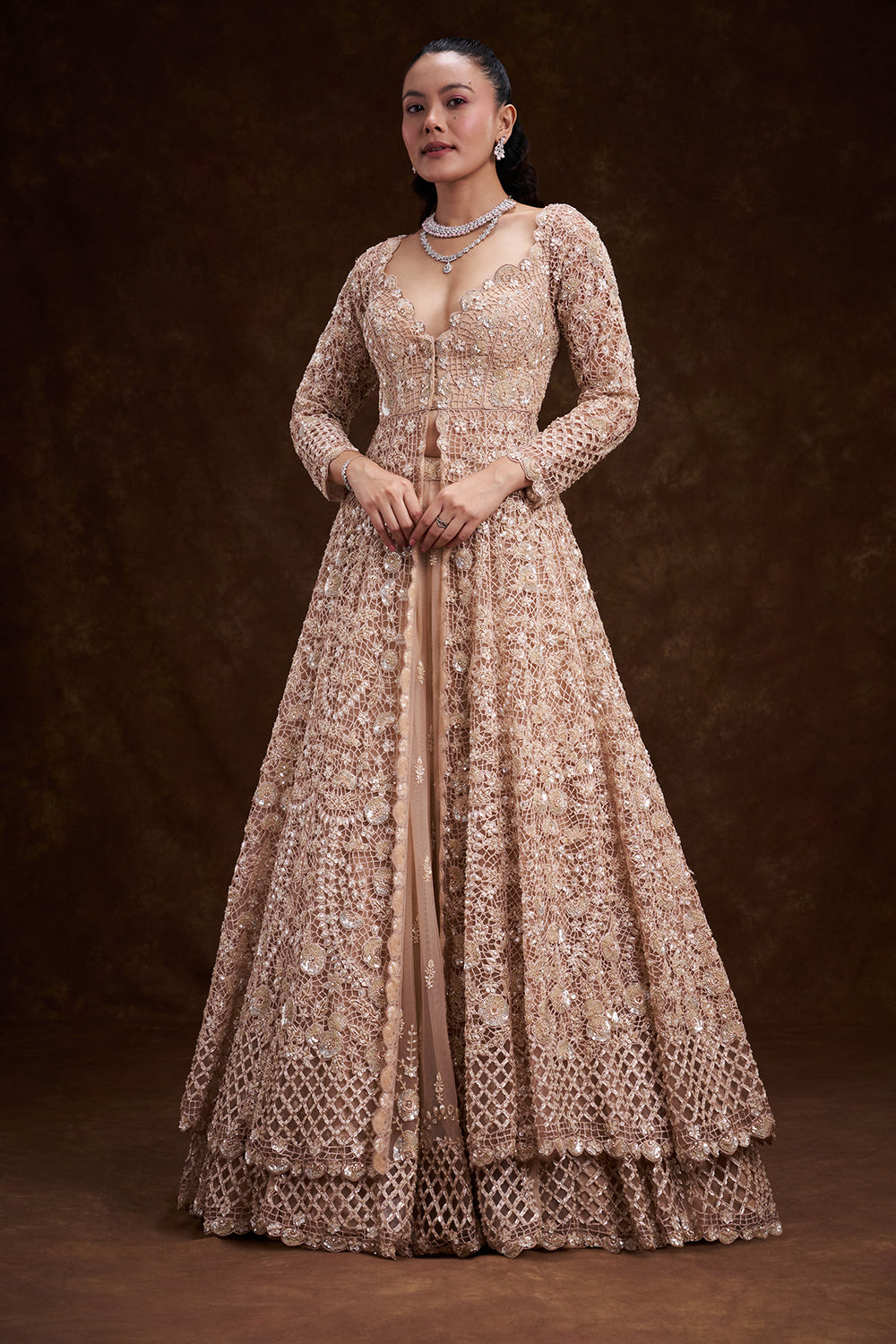 Peach Net Bridal Jacket Lehenga with Cutdana and Bead Embellishments