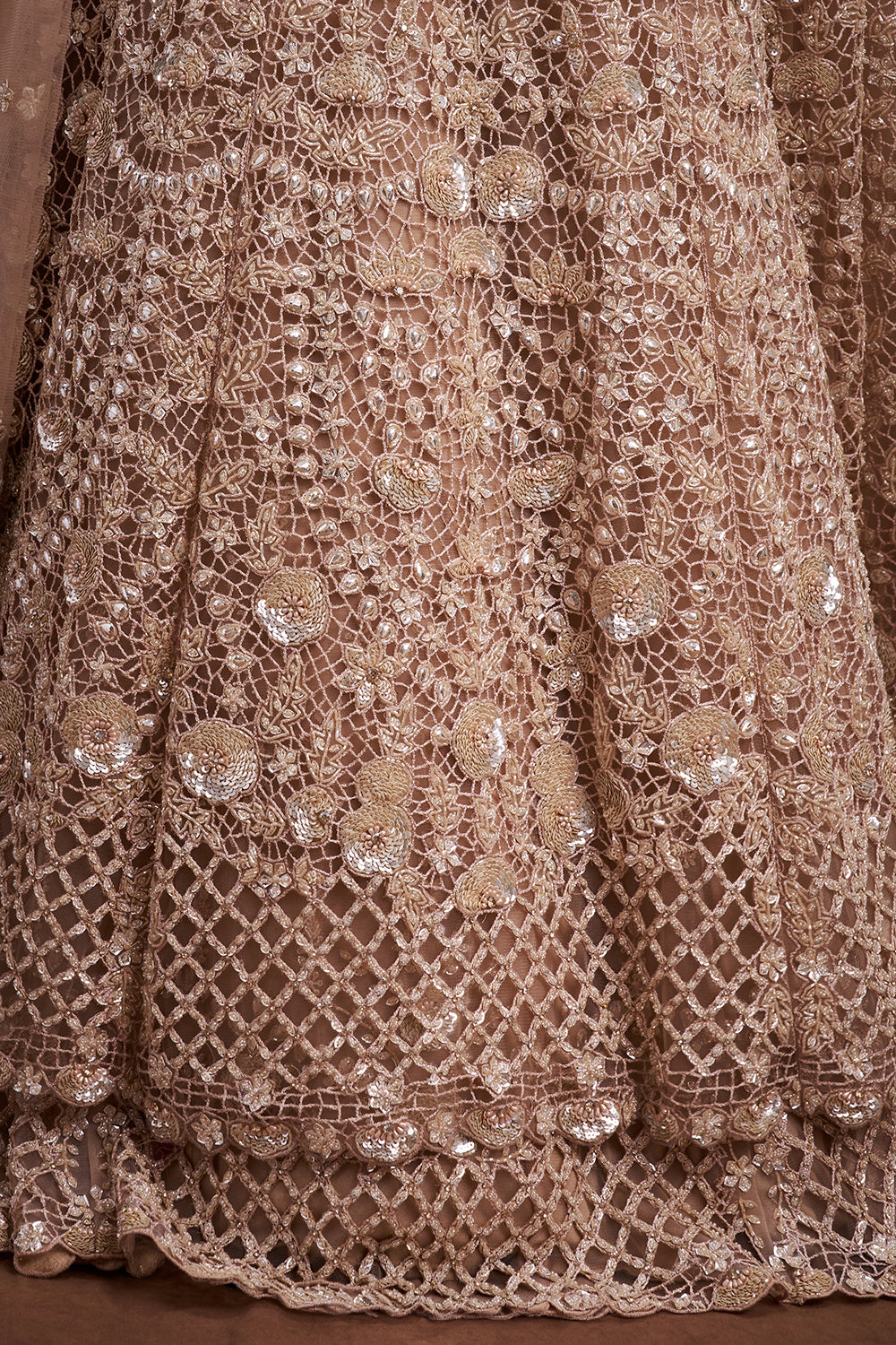 Peach Net Bridal Jacket Lehenga with Cutdana and Bead Embellishments