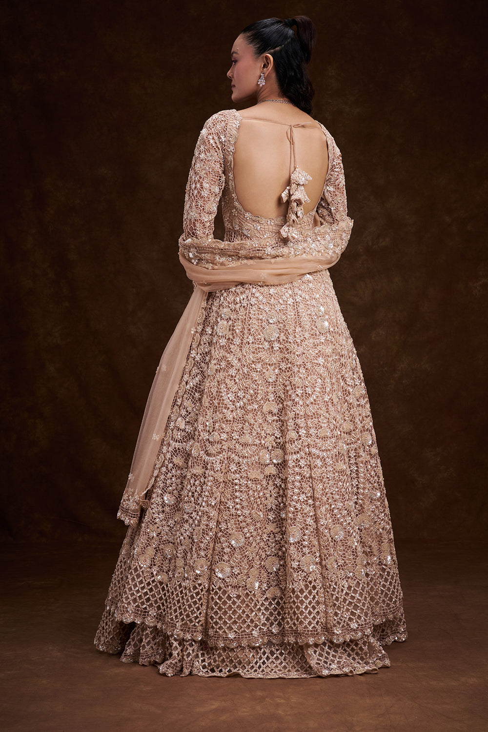 Peach Net Bridal Jacket Lehenga with Cutdana and Bead Embellishments