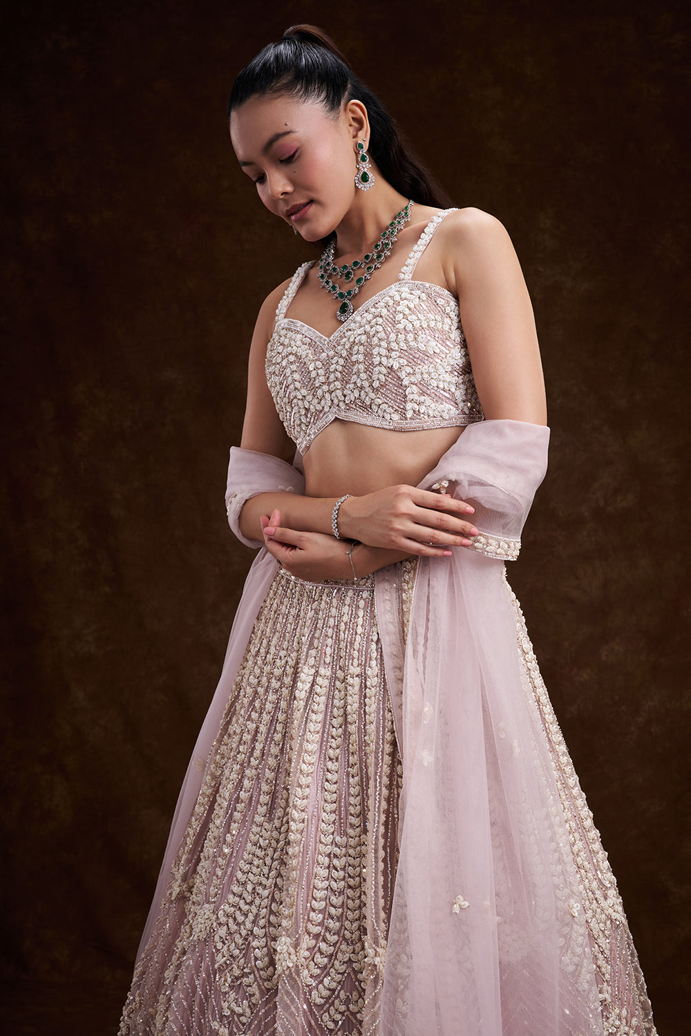 Pink Net Bridal Lehenga with Mother of Pearl Embellishments