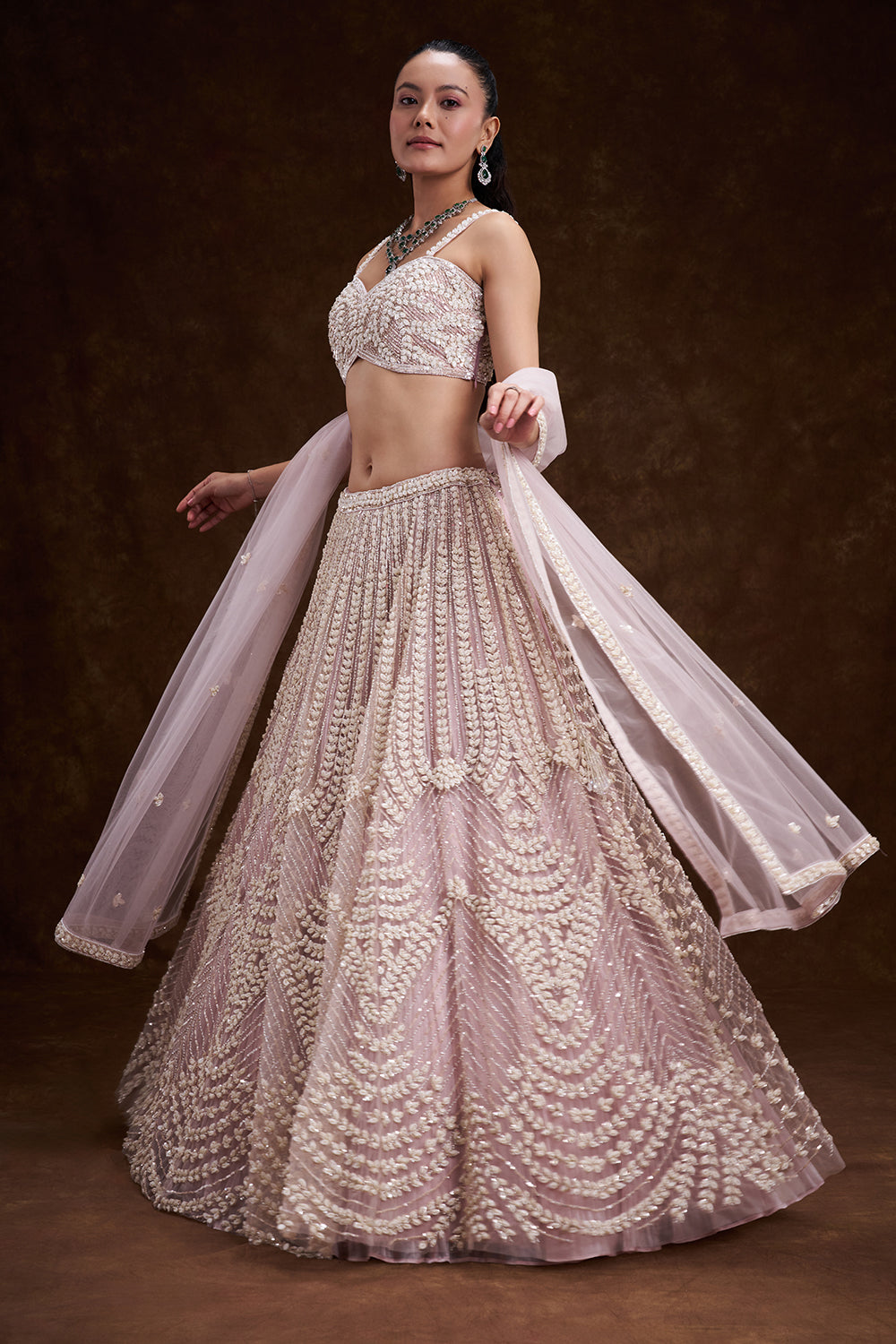 Pink Net Bridal Lehenga with Mother of Pearl Embellishments
