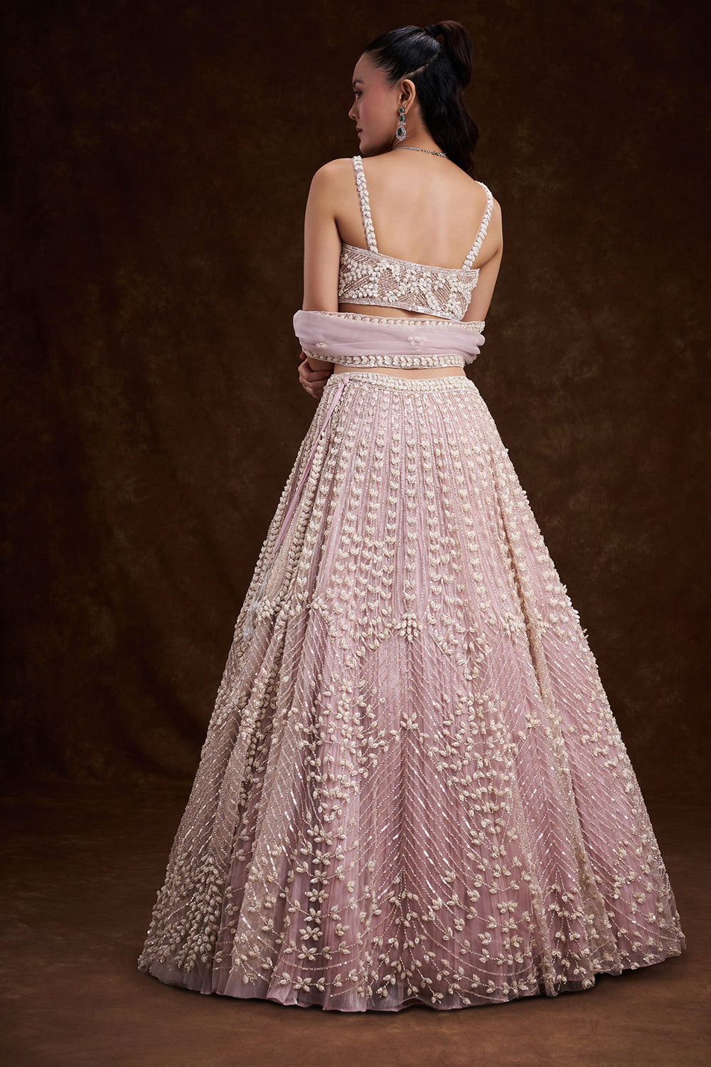 Pink Net Bridal Lehenga with Mother of Pearl Embellishments