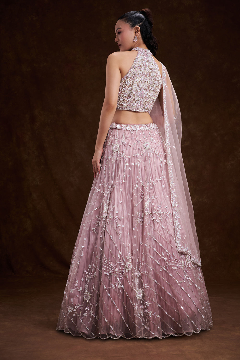 Pink Net Bridal Lehenga with Ornate Halter Blouse and Embellished Dupatta