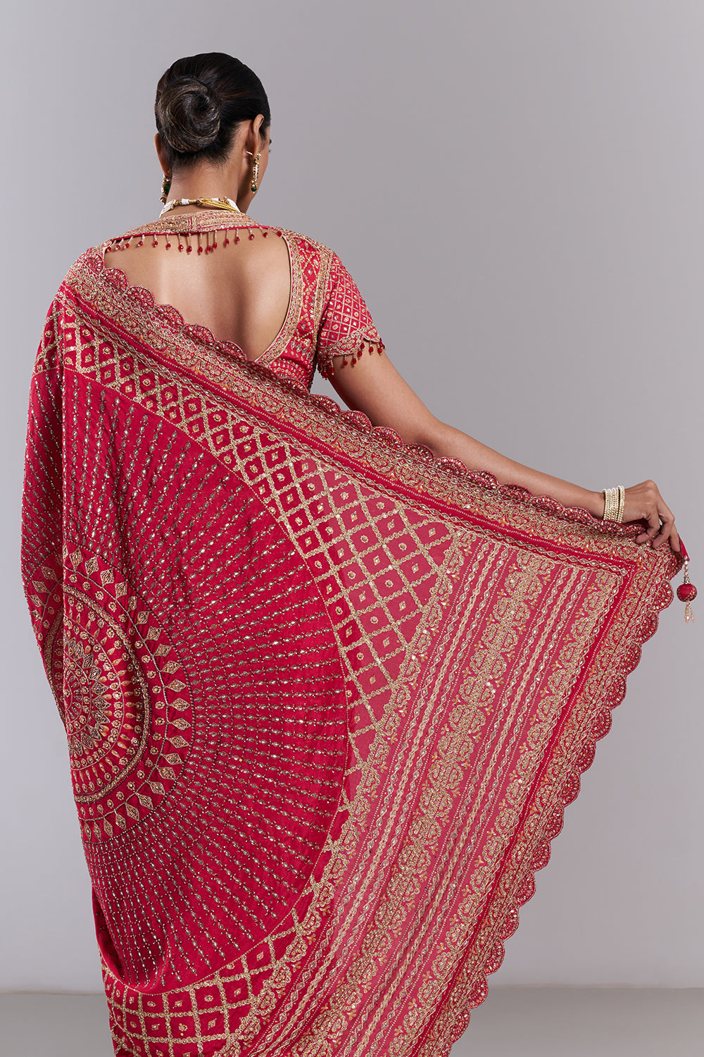 Rani Pink Georgette Embellished Saree And Stitched Blouse