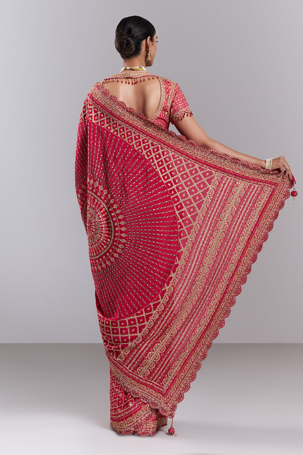 Rani Pink Georgette Embellished Saree And Stitched Blouse