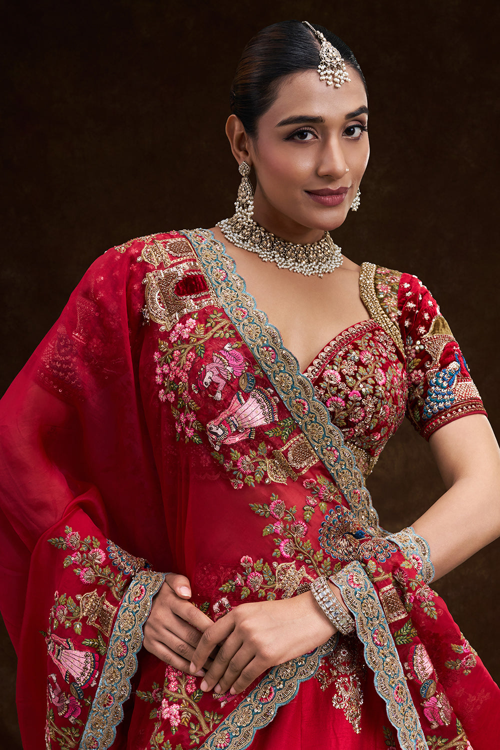 Red Raw Silk Bridal Lehenga with Royal Garden Zardozi Work and Velvet Blouse