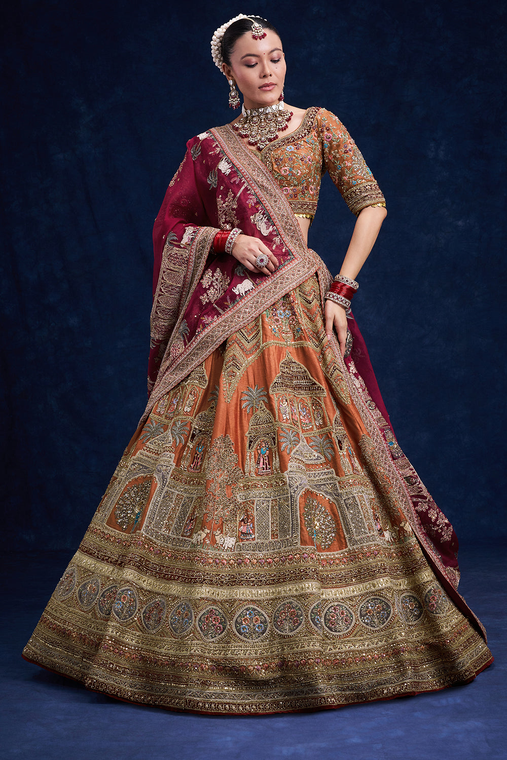 Rust Red Raw Silk Bridal Lehenga with Regal Zardozi Work