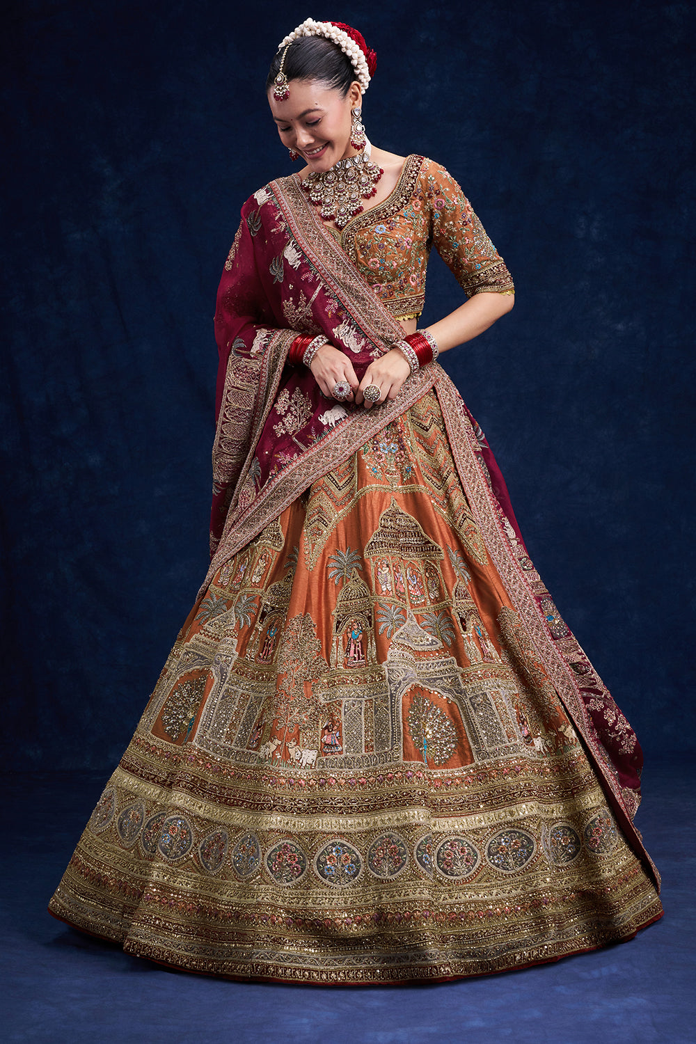 Rust Red Raw Silk Bridal Lehenga with Regal Zardozi Work