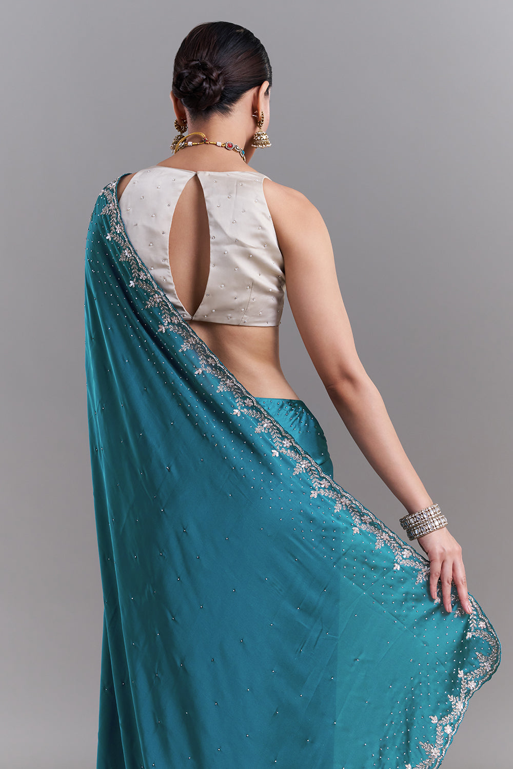 Teal Blue Satin Saree With Ornate Floral Embellishments