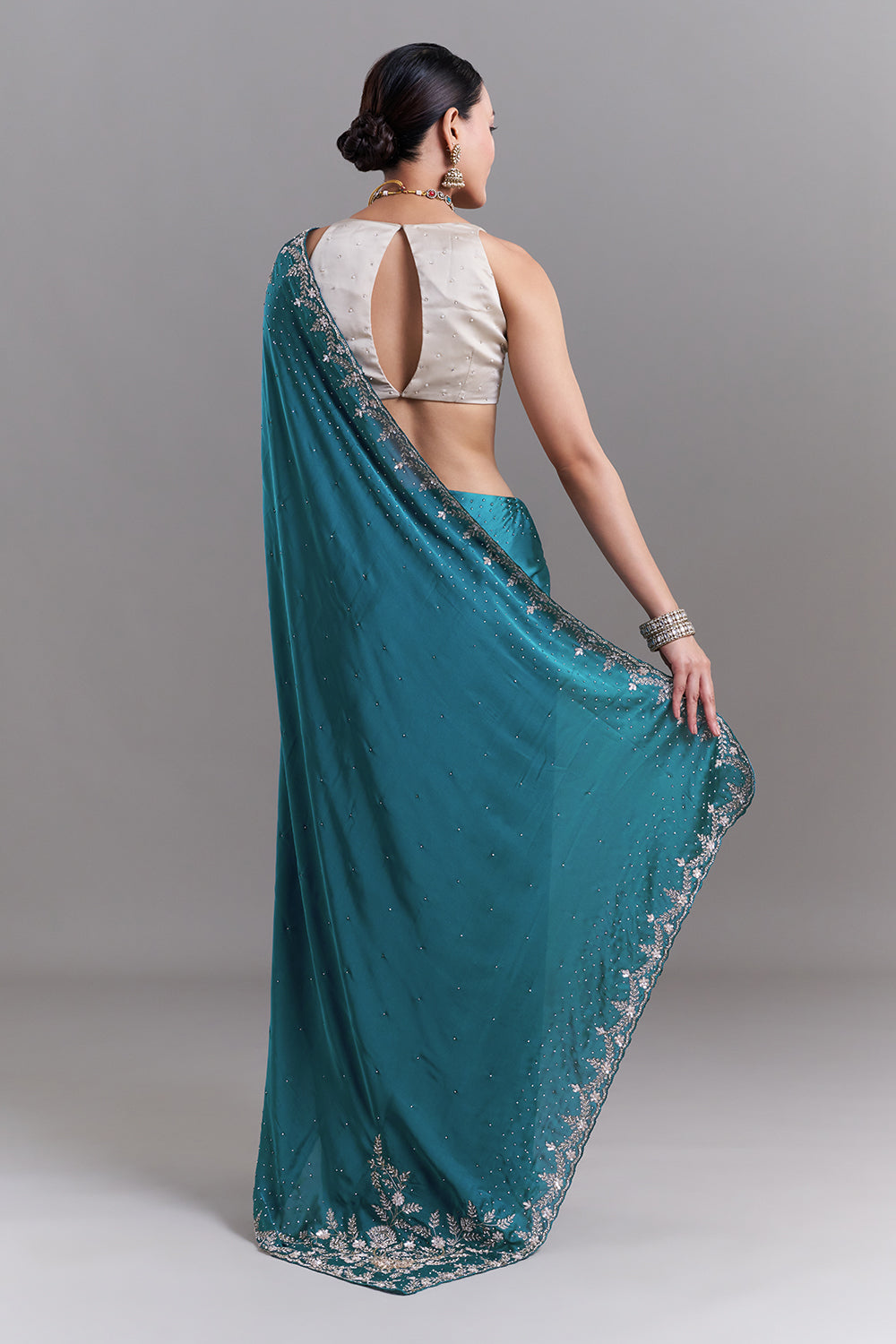 Teal Blue Satin Saree With Ornate Floral Embellishments
