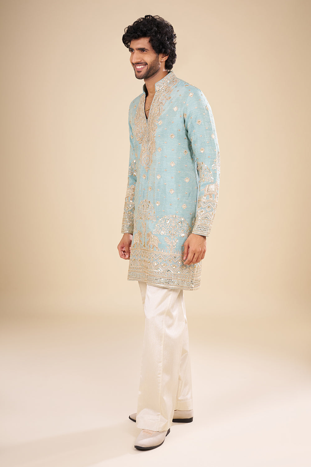 Turquoise Blue Silk Kurta Set with Nature-Inspired Embroidery