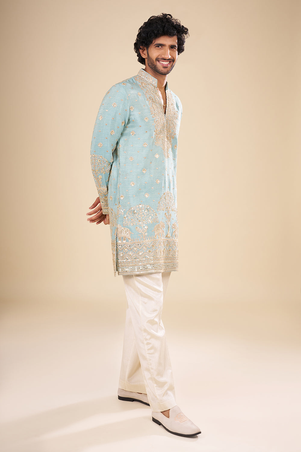 Turquoise Blue Silk Kurta Set with Nature-Inspired Embroidery