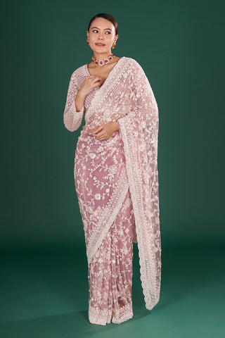 Mauve Embroidered Net Saree with Floral Embellishments and Stitched Blouse