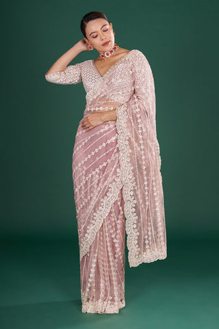 Onion Pink Net Saree with Scalloped Border and Stitched Blouse